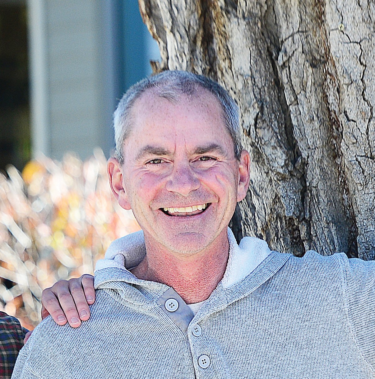 Photo of Bob Pole standing in front of a tree.