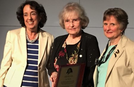 Karen Peltz-Strauss, Sheila Conlon-Mentkowski holding the award plaque and Lise Hamlin receiving the award