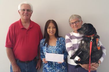 Michael Sweeney, HLAA chapter president, Rieko Darling, and Charlene MacKenzie, co-founder of the chapter in 2004 (shown with her hearing service dog, Lola.)