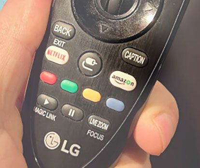 Close up of caption button on a television remote