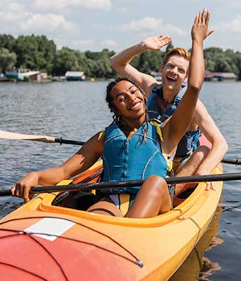 Two young adults kayaking